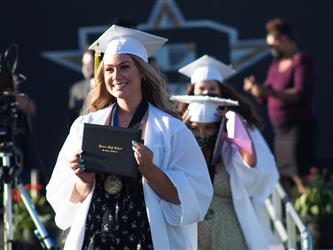 Student holding a diploma