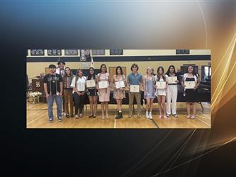 students holding their awards