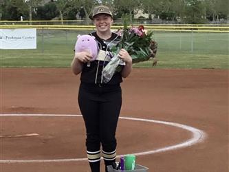 Softball player posing for pic