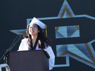 Student giving speech in front of the PHS star