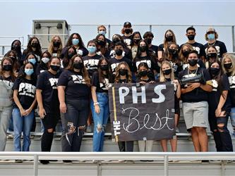 students standing in a football bleachers