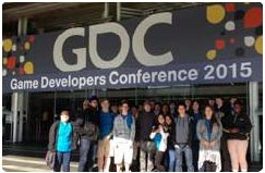 students standing in front of the GDC entrance
